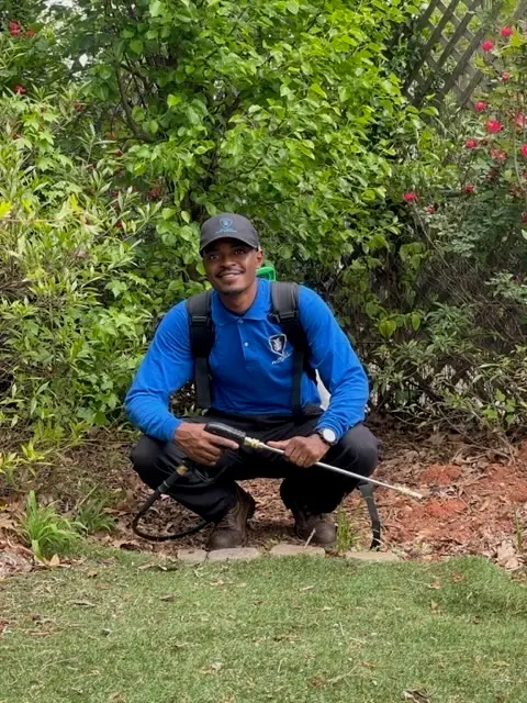 Curtiss Wheeler, owner of Allsect Pest Control, treating an Atlanta home